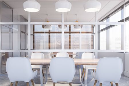 Interior of modern meeting room in office with white and glass walls, concrete floor and long wooden conference table with white chairs. Concept of discussion. 3d renderingの写真素材