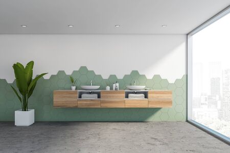 Interior of stylish panoramic bathroom with white and green hexagon tile walls, concrete floor,...