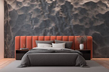 Interior of modern bedroom with crude gray and pink walls, wooden floor and comfortable orange king...