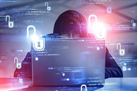 Young African American hacker using laptop in blurry office with double exposure of cyber security...