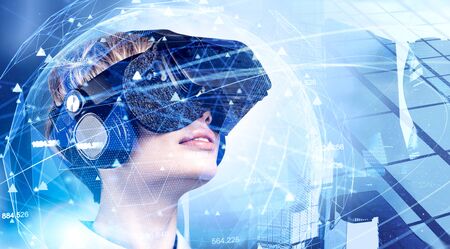 Blonde woman in VR glasses looking at immersive network interface in city. Concept of hi tech and...