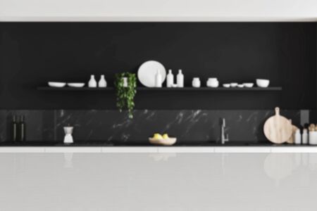 White table for your product in blurry luxury kitchen with black marble walls, white countertops and black shelf with dishes. Concept of advertising. 3d rendering copy spaceの写真素材