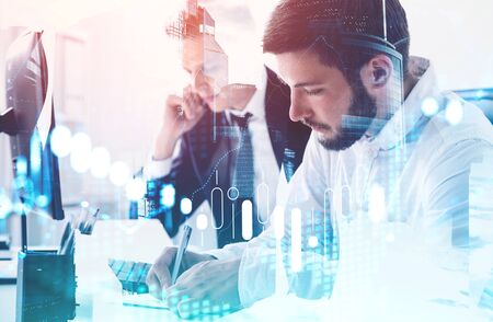 Two businessmen working together in blurry office with double exposure of Moscow city panorama and...