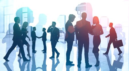 Silhouettes of young diverse business people working together in modern office. Concept of corporate lifestyle and international partnership. Toned image double exposureの写真素材