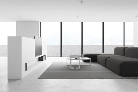 Interior of panoramic luxury living room with white walls, concrete floor, comfortable grey sofa, two round coffee tables and flat screen TV. Balcony with nice blurry scenery. 3d renderingの写真素材