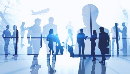 Silhouettes of business people in airport. Concept of travel and international partnership. Creative double exposure effect. Toned blurry imageの写真素材