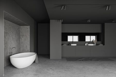 Interior of loft bathroom with grey and concrete walls, concrete floor, double sink with long mirror...