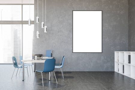 Interior of empty loft style office with concrete walls and floor, long glass table with blue chairs...