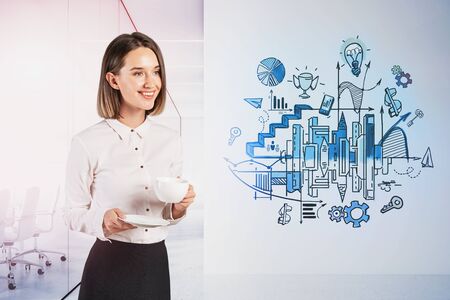 Cheerful European businesswoman drinking coffee in blurry white office with creative business sketch drawn on wall. Concept of planning and business strategy. Toned imageの写真素材