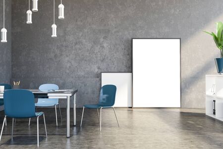 Interior of loft meeting room with concrete walls and floor, big table with blue chairs, white bookshelves with folders and vertical mock up poster standing on the floor. 3d renderingの写真素材