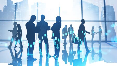 Teamwork and trading concept. Silhouettes of business people in office with double exposure of blurry digital graph. Toned imageの写真素材