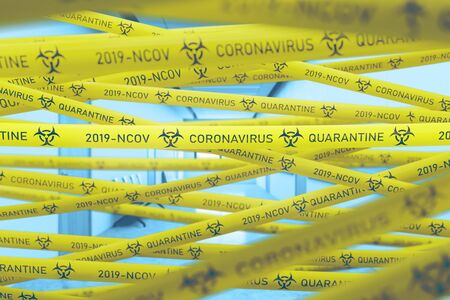 Concept of coronavirus ncov covid 19 quarantine and lockdown. Bright yellow tapes over blurry hospital corridor background. 3d renderingの写真素材