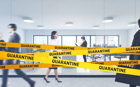 Modern corporate office with blurry business people on quarantine. Concept of working from home during 2019 ncov coronavirus pandemicの写真素材
