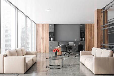 Interior of luxury CEO office with grey and wooden walls, computer table and lounge area with two...