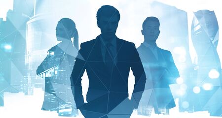 Silhouettes of three diverse confident business people working together in abstract blurry city with creative double exposure effect. Concept of leadership. Toned imageの写真素材