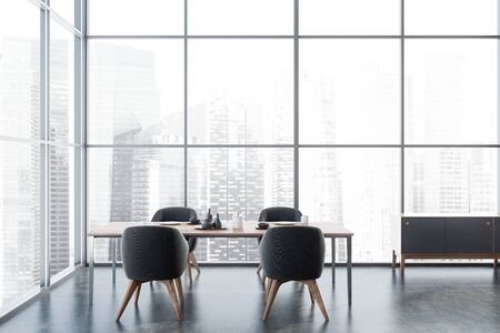 Interior of luxury panoramic dining room with concrete floor, wooden table with grey armchairs and...