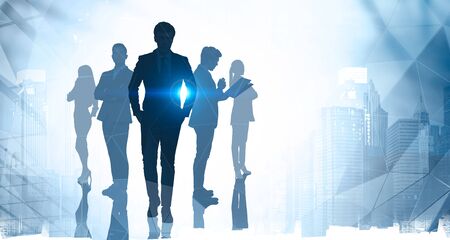 Concept of leadership. Five successful business people silhouettes over blurry abstract city background. Toned image double exposureの写真素材