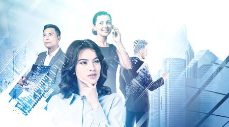 Four successful diverse business people working together in blurry abstract city. Concept of teamwork and partnership. Toned image double exposureの写真素材