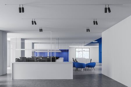 Interior of stylish open space office with white and blue walls, concrete floor and white reception...