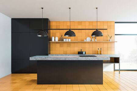 Front view of modern kitchen with yellow tiled walls and floor, black cupboard and island and stone countertops with sink. Window with blurry scenery. 3d renderingの写真素材