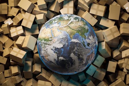 Planet Earth lying among cardboard parcels. Concept of post and goods delivery during covid 19 pandemic.の写真素材