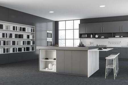 Corner of modern kitchen with grey walls, concrete floor, gray countertops and cupboards, bar with...