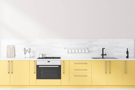Interior of spacious minimalistic kitchen with white walls, concrete floor and bright yellow countertops with built in cooker and sink. 3d renderingの写真素材