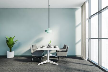 Side view of stylish panoramic dining room with blue walls, carpeted floor, white table with gray armchairs and window with blurry cityscape. 3d renderingの写真素材