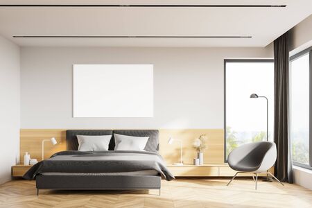 Interior of modern Scandinavian style bedroom with white and wooden walls, wooden floor, grey king size bed, comfortable armchair and mock up poster. 3d renderingの写真素材