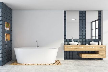 Interior of modern bathroom with white and gray tile walls, concrete floor, comfortable double sink standing on wooden countertop with two mirrors and bathtub. 3d renderingの写真素材