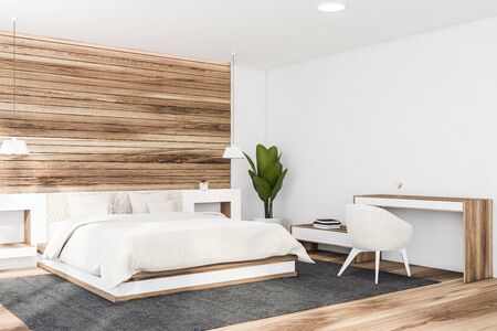 Corner of stylish master bedroom with white and wooden walls, wooden floor, comfortable king size bed with white bedside tables and home office with table and armchair. 3d renderingの写真素材