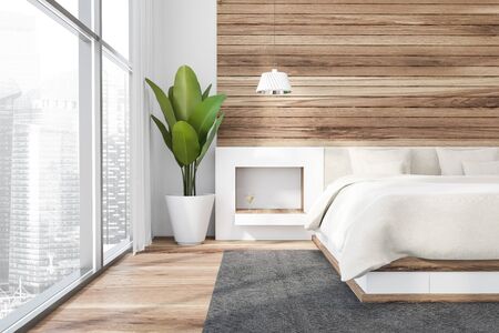 Front view of stylish master bedroom with white and wooden walls, wooden floor, comfortable king...