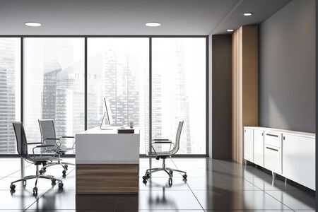 Side view of minimalistic CEO office with grey and wooden walls, tiled floor and original computer desk. Concept of management. Window with blurry cityscape. 3d renderingの写真素材