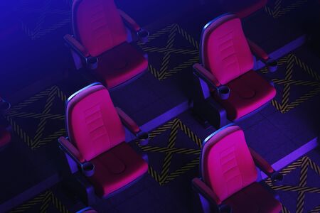 Red cinema seats in dark room with empty spaces between them. Concept of covid 19 lockdown easing. 3d rendering toned imageの写真素材