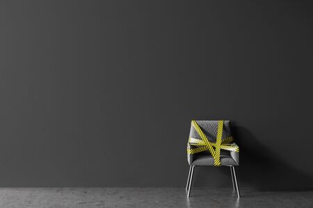 Comfortable grey chair covered with yellow barrier tape standing in public place with gray walls. Concept of social distancing and covid 19 lockdown easing. 3d renderingの写真素材