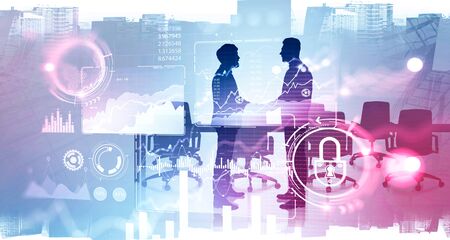 Silhouettes of two businessmen shaking hands in conference room with double exposure of blurry...