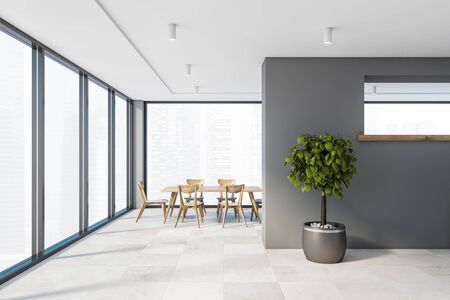 Interior of stylish panoramic dining room with gray walls, tiled floor, long table with chairs and potted tree. Window with blurry cityscape. 3d renderingの写真素材