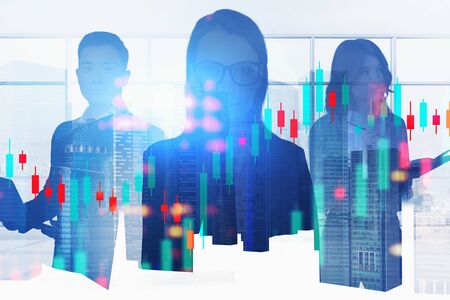 Silhouettes of diverse traders working together in blurry panoramic city office with double exposure...