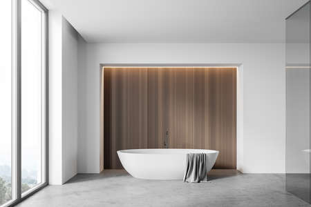 Interior of panoramic bathroom with white and wooden walls, concrete floor, comfortable bathtub with...