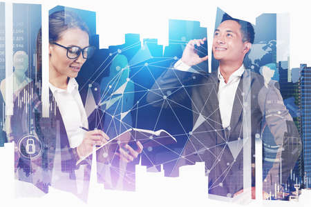 Smiling Asian businessman and European businesswoman working with their team in blurry city with...