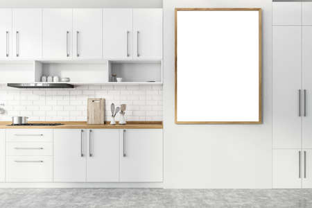Vertical mock up poster frame hanging in modern kitchen with white and brick walls, concrete floor, white cupboards and countertops with built in cooker. 3d renderingの写真素材