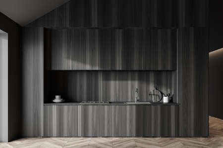Interior of stylish attic kitchen with gray and dark wooden walls and wooden countertops with built in cooker and sink. 3d renderingの写真素材