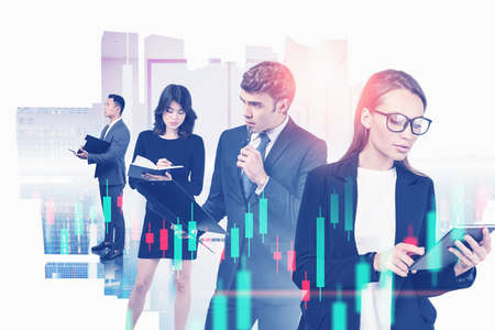Portraits of diverse business people working together in abstract city office with double exposure...