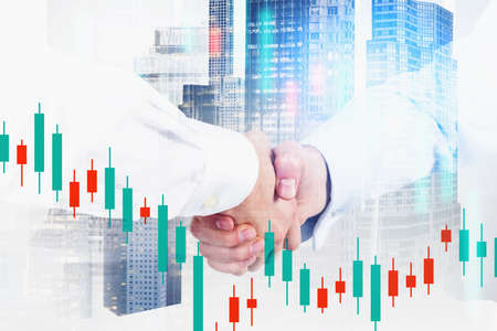 Two businessmen shaking hands in abstract city with double exposure of blurry financial chart....