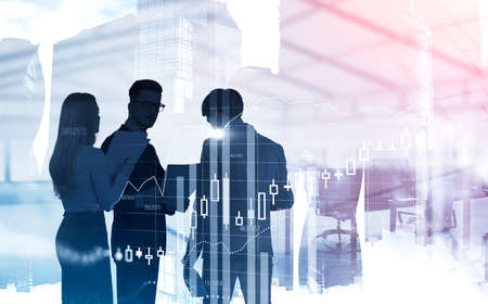 Concept of trading. Silhouettes of three business people working with documents in blurry city...