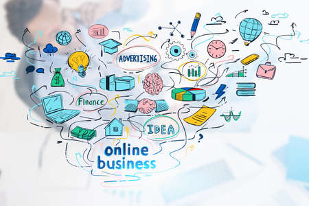 Top view of smiling African American businessman talking on smartphone in blurry office with double exposure of colorful online business sketch. Concept of e commerce. Toned imageの写真素材