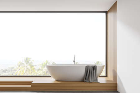 Interior of modern panoramic bathroom with white and wooden walls, stairs and comfortable bathtub standing near window with blurry tropical view. 3d renderingの写真素材