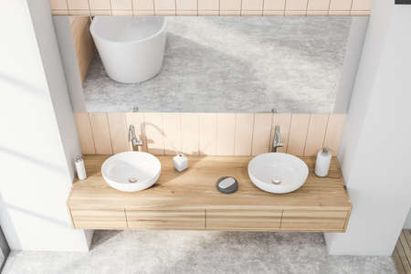 Top view of stylish bathroom with beige tiled and gray walls, concrete floor, and comfortable double sink with horizontal mirror. 3d renderingの写真素材