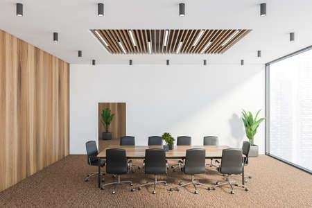 Interior of modern conference room with white and wooden walls, carpeted floor, long meeting table...