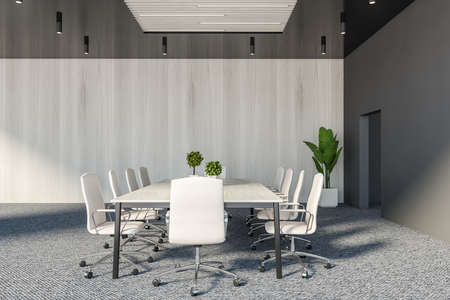 Side view of stylish conference room with gray and wooden walls, carpeted floor, long meeting table...